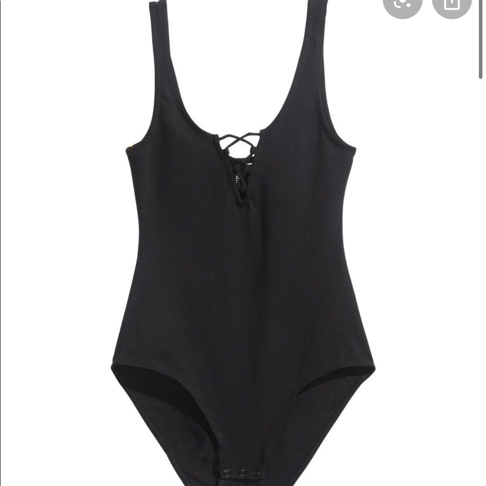 Black crisscrossed button body suit